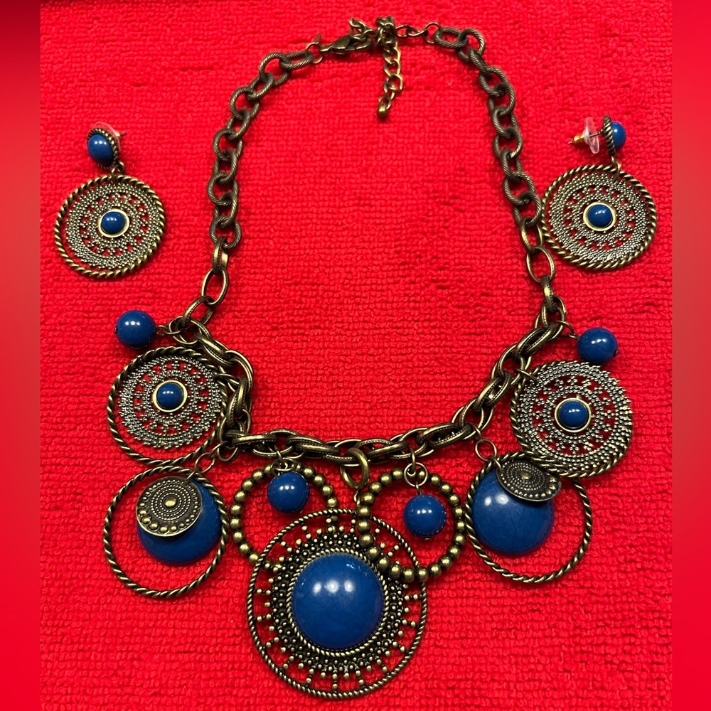 Pretty bronze and blue Premiere Designs necklace and earring set.